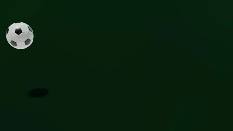 Soccer ball bouncing across frame on dark green background Stock Footage 335659590