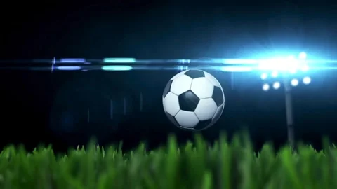 Soccer ball bouncing on green grass under stadium lights Video stock 336399213