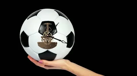 Soccer Ball Clock on the hand, on the black background, Timelapse Stock Footage 10869733