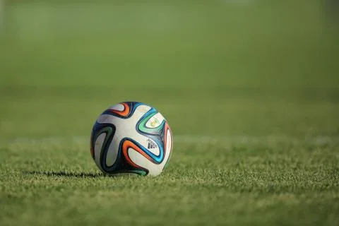 Soccer ball in field Stock Photos