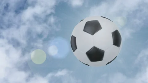 Soccer ball flies at the camera then stops but keeps rotating. Stock Footage 39023022