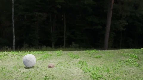 Soccer ball going back and forth on an uneven, grassy field. Stock Footage 330759170