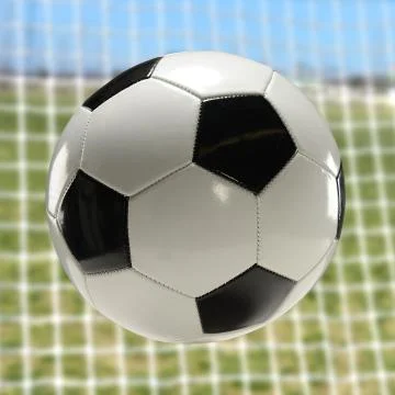 Soccer ball going toward net Stock Photos
