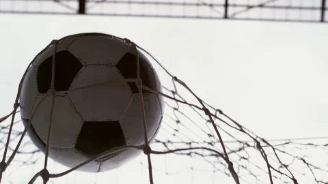 Soccer ball hits the back of the net in slow motion Stock Footage