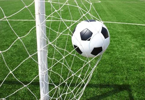 Soccer ball in net 스톡 사진