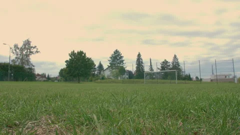 Soccer ball rolling from right to left on an empty soccer ball Stock Footage 153377960