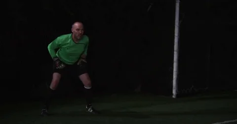 Soccer ball slips right between a Goalies fingers. Slow motion. Stock Footage 69214649