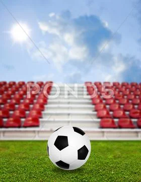 Soccer ball in sport arena with nice sky background Stock Photos