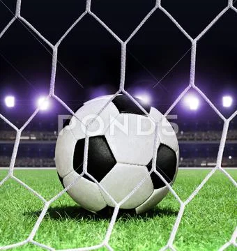 Soccer ball on stadium Stock Photos