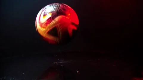Soccer ball in water splashes rotating 360 degrees Video stock 331283020