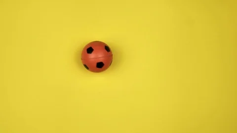 Soccer ball on yellow background Video stock 123443570