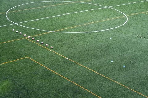 Soccer balls lined up for training session. Stock Photos