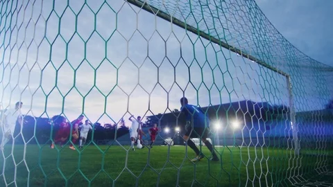 On Soccer Championship Player Kicks the Ball and Goalkeeper Tries to Defend Goal Stock Footage