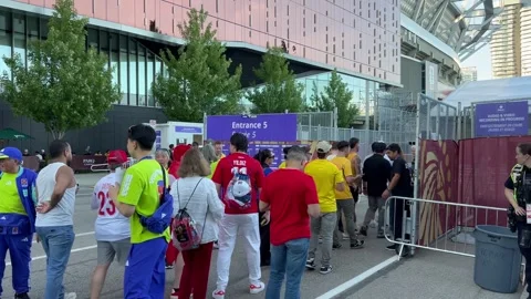 Soccer fans queue at a BC Place stadium gate during FIFA World Cup Stock Footage 337155027