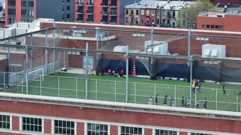 Soccer Feild Top Floor Building Urban Area people practicing 2 스톡 동영상 272168139
