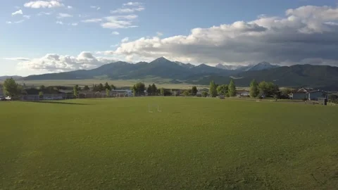 Soccer field in mountain town 스톡 동영상 166332763