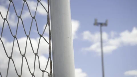 Soccer field net and lights with cloudy sky Stock Footage 307493298