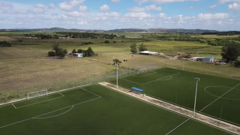 Soccer field rotating showing different perspectives in rural landscape Stock Footage 306386728