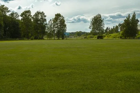 Soccer field surrounded by trees Stock Photos