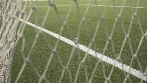 Soccer field through goal net: multiple close-ups Stock Footage 307492702