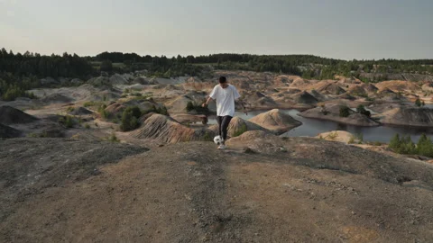 Soccer freestyler performs tricks with the ball on a background of beautiful Stock Footage 133570066