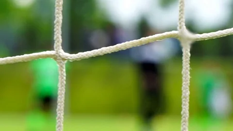 Soccer game seen through net, blurred view Video stock 75742143