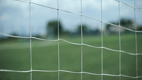 Soccer goal net, close-up, on the background of a field with grass Video stock 127960793
