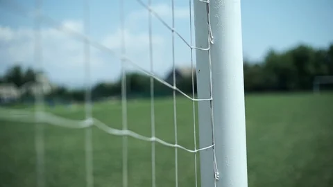 Soccer goal net, close-up, on the background of a field with grass Vídeo Stock 127960805