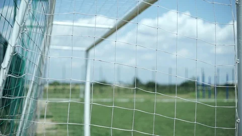 Soccer goal net, close-up, on the background of a field with grass Stock Footage 127960816