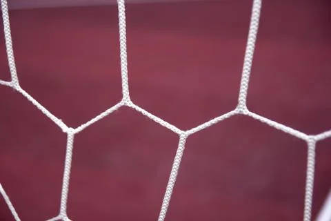Soccer goal net on red background. Sport theme Stock Photos