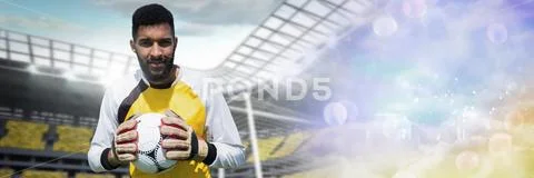 Soccer goalkeeper holding ball near goal with transition Stock Photos