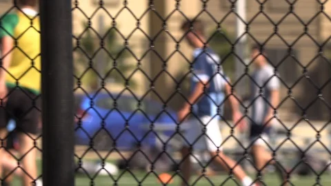 Soccer Play view through a linked fence. Stock-Footage 127610557