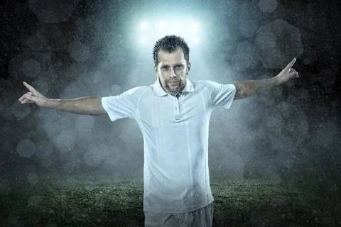 Soccer player with ball in action outdoors Stock Photos