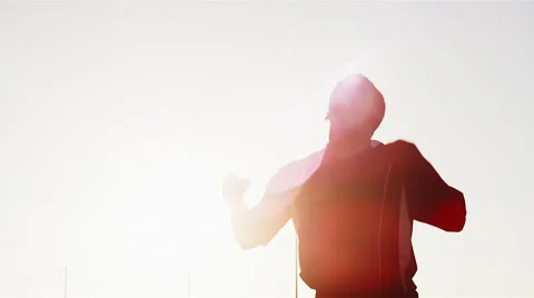 A soccer player does a bicycle kick at sunset Video stock 57467220