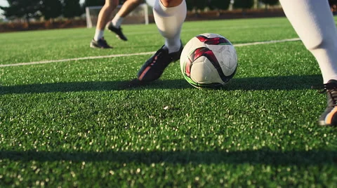 A soccer player does some fancy footwork and opponents slide tackle him Stock Footage 56147318