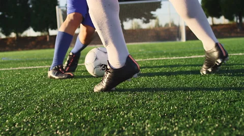 A soccer player does some fancy footwork while going up against other players Video stock 56148612