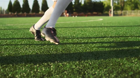 A soccer player does some fancy footwork and opponents slide tackle him Stock Footage