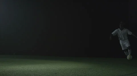 A soccer player dribbles the ball and attacks a defender Stock Footage 34008338