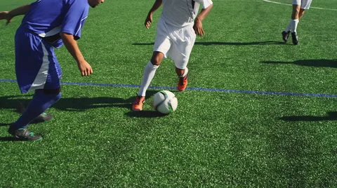 A soccer player dribbles down the field as an opponent defends him, and goals Video stock 56137378