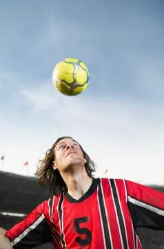 Soccer player headering the ball Stock Photos
