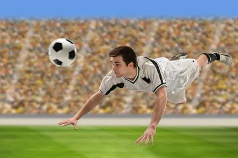 Soccer player heading ball Stock Photos