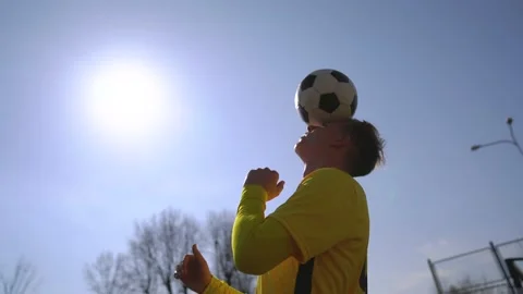 A Soccer Player Hits The Ball To Move It.   is A Soccer Technique. Backlight Stock Footage 152081090