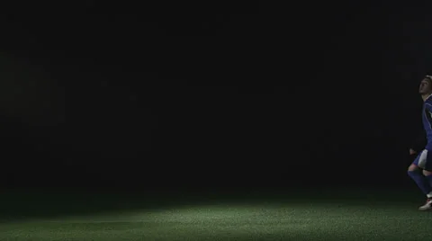 Soccer player jumps in the air sideways and kicks a soccer ball Stock Footage 34007552