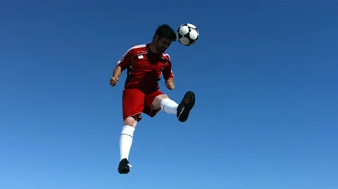 Soccer player jumps in the sky, slow motion Stock Footage