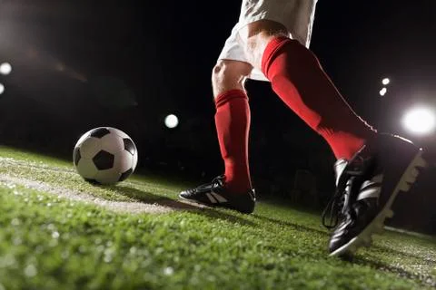 Soccer player making a corner kick Stock Photos