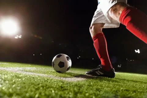 Soccer player making a corner kick Stock Photos
