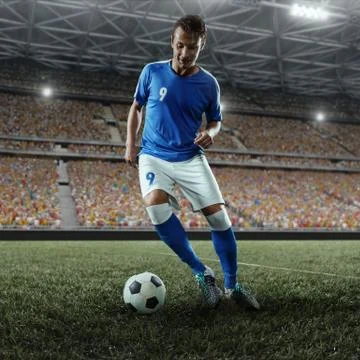 Soccer player performs an action play on a professional stadium Foto stock