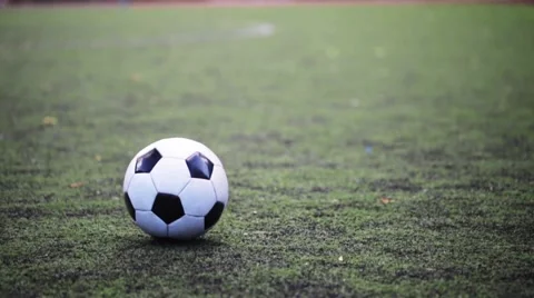 Soccer player playing with ball on field Stock Footage