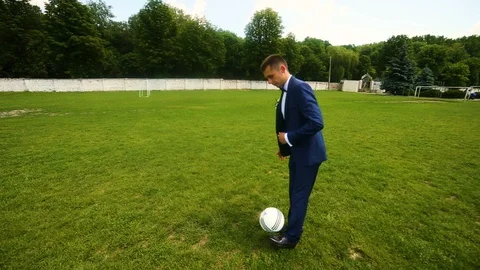 Soccer player playing with ball on field. Wide angle. Stock Footage 95560993
