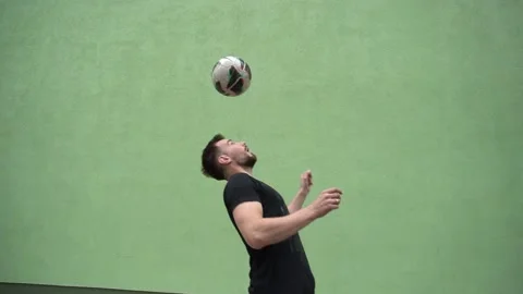 Soccer player plays with the ball. Doing football tricks. Outdoor. Slow motion Stock Footage 90848212